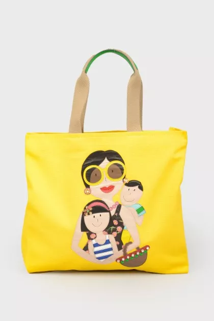 Yellow shopper with a print with a tag