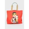 Red shopper with a print with a tag