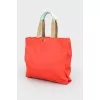 Red shopper with a print with a tag