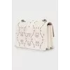 Leather bag decorated with perforation