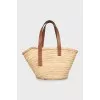 Woven bag with leather handles and logo