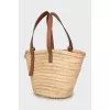 Woven bag with leather handles and logo