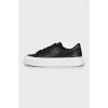 Black leather sneakers with embossing