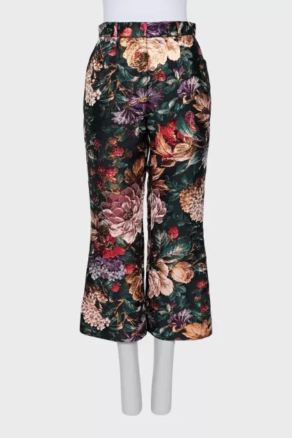 Black floral print trousers with tag