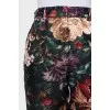 Black floral print trousers with tag