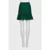 Green pleated skirt