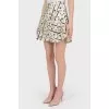 Beige skirt-shreds in print with tag