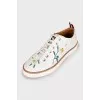Leather sneakers with floral embroidery