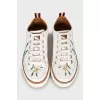 Leather sneakers with floral embroidery