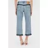 Blue jeans with black trim with tag