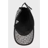 Black and white cap with signature monogram