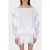 White blouse with stumps on the sleeves with a tag