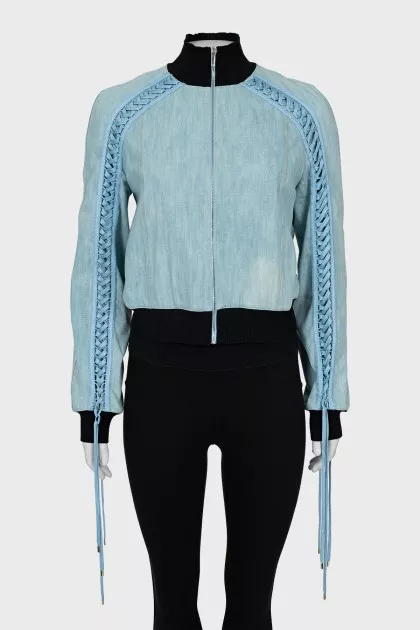 Jacket decorated with lacing
