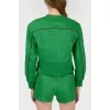 Green denim jacket with tag