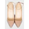 Beige patent leather heeled shoes