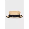 Straw hat with textile inserts
