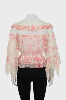 Button-down blouse decorated with lace