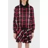 A jacket in an abstract checkered print with a tag