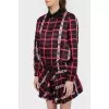 A jacket in an abstract checkered print with a tag