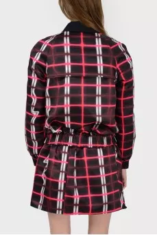 A jacket in an abstract checkered print with a tag