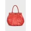 Orange snakeskin bag