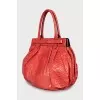 Orange snakeskin bag