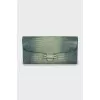 Green leather clutch