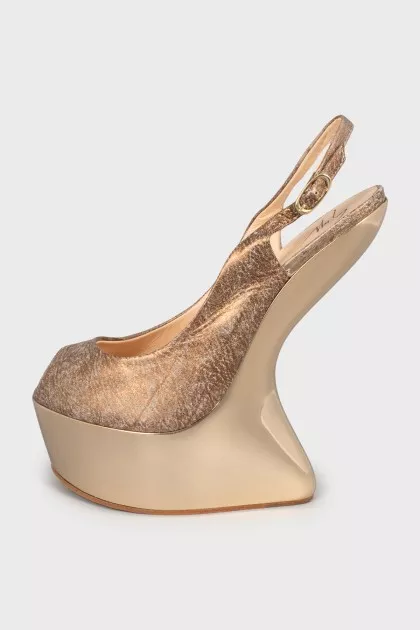 Leather sandals with gold wedge heel