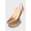 Leather sandals with gold wedge heel
