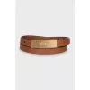 Leather belt with gold buckle