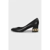 Leather shoes with decorated heels
