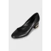 Leather shoes with decorated heels