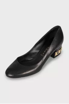 Leather shoes with decorated heels