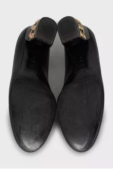 Leather shoes with decorated heels