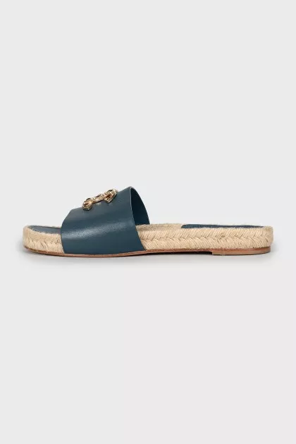 Leather flip flops with rhinestones on the logo