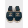 Leather flip flops with rhinestones on the logo
