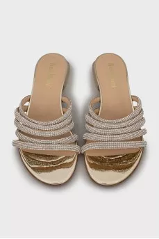 Leather flip flops decorated with rhinestones