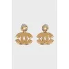 Earrings in the form of a company logo