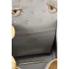 Leather bag decorated with flowers