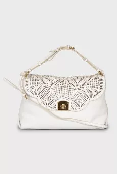 Leather bag with decorative slits