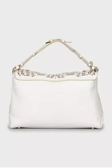 Leather bag with decorative slits