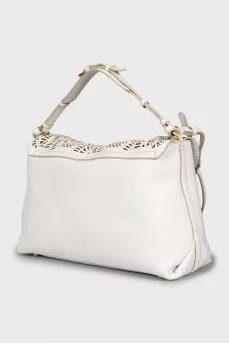 Leather bag with decorative slits