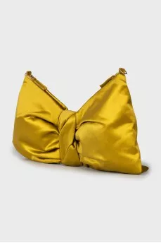Textile bag in the form of a bow