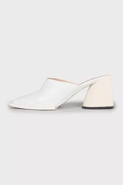 White mules with a figured heel