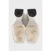 White mules with a figured heel