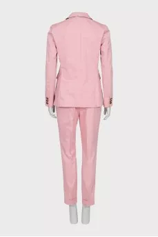 Trouser suit with accent buttons