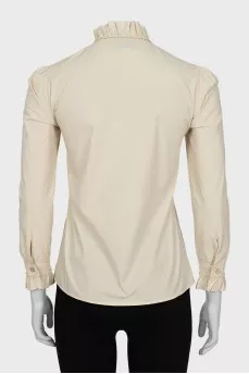 The shirt is decorated with bows