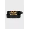Black leather belt with signature buckle