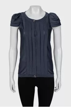 Blouse decorated with pleats