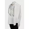 Silk blouse decorated with chain